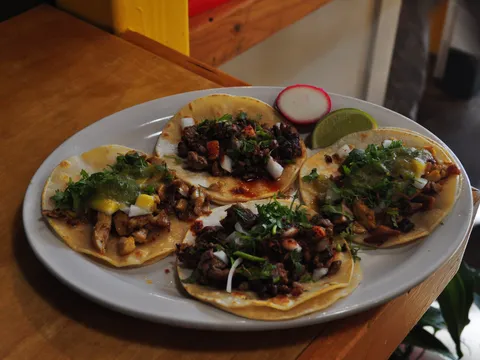 Four street-style tacos served at Taqueria Portland