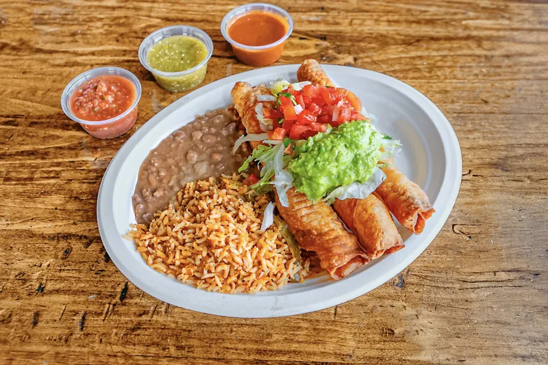 Flauta plate with rice, beans, guacamole, and salsas at Pokez Mexican Restaurant