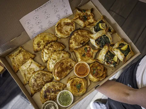 Box of freshly baked empanadas from Rincon Argentino