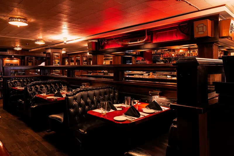 Dining room booths and bar at The Golden Ox steakhouse