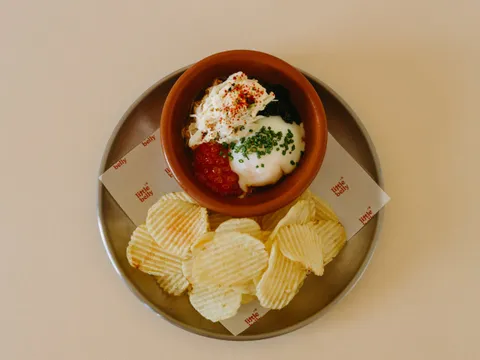 Small plate with chips, roe, egg, and crab at Little Belly
