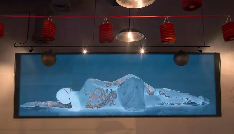 Illuminated reclining dragon artwork inside Fat Dragon
