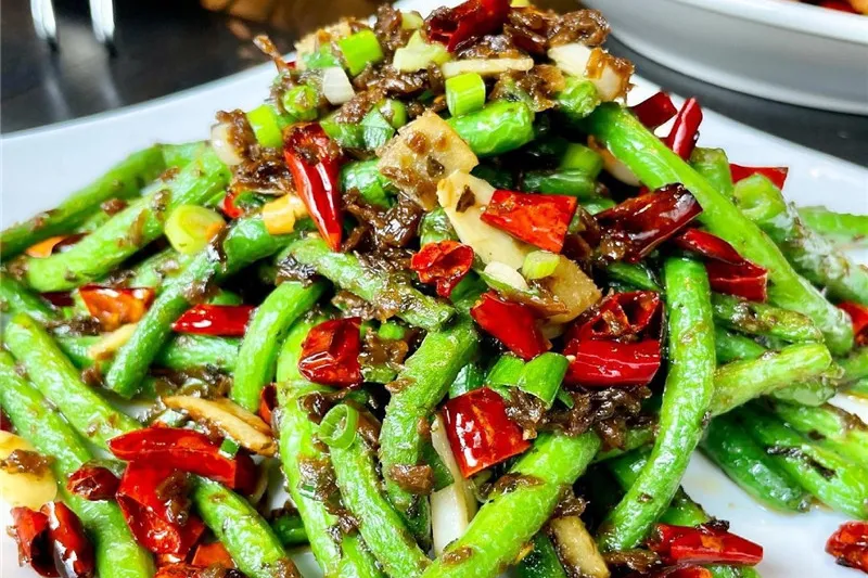 Sichuan dry-fried string beans with dried chili peppers, garlic and preserved vegetables at Xiang La Hui
