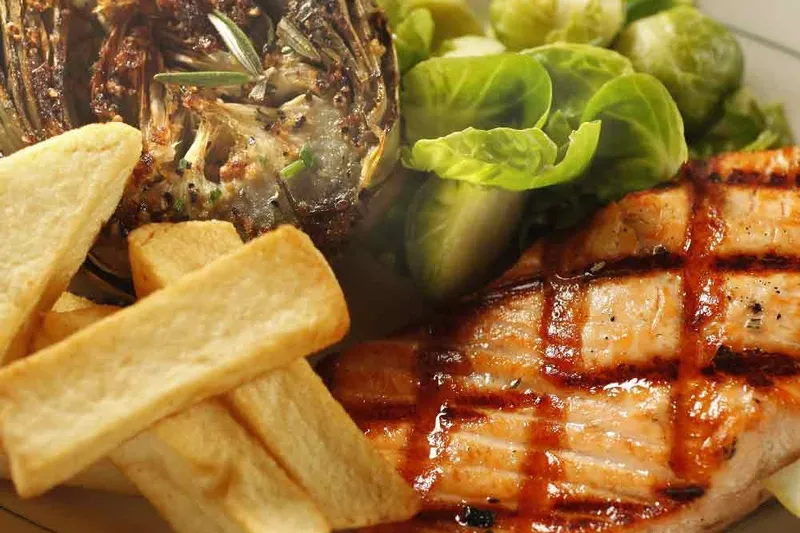 Grilled salmon with artichoke, Brussels sprouts and fries at Tadich Grill