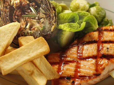 Grilled salmon with artichoke, Brussels sprouts and fries at Tadich Grill