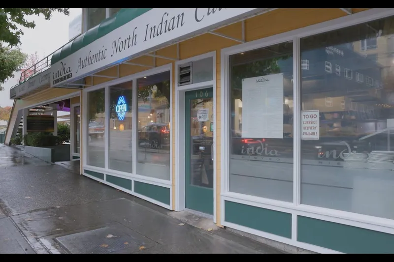 Green-trimmed storefront of India Bistro on Roosevelt Way in Seattle