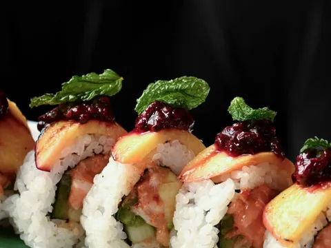 Peach and mint topped sushi roll at RED