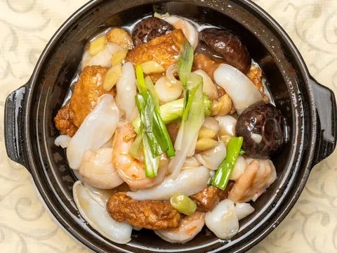 Clay pot of seafood with prawns, squid, scallops, fried tofu and shiitake mushrooms at East Ocean Seafood Restaurant