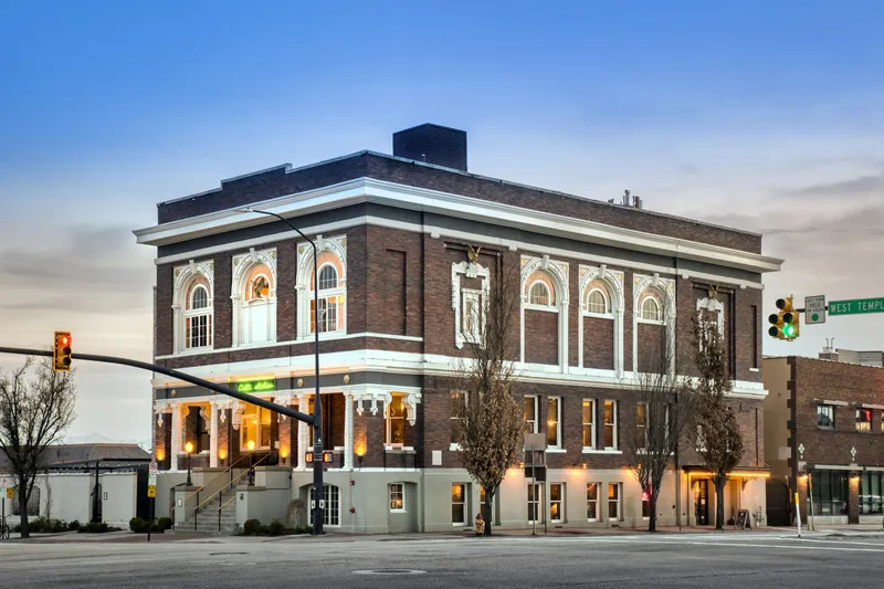 Exterior of the historic brick building housing Caffé Molise at dusk