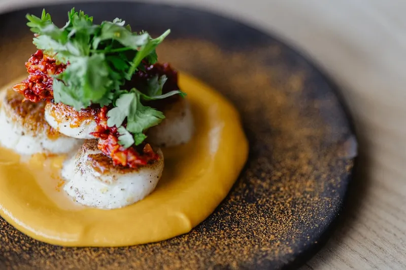 Seared scallops with carrot purée and salsa at Colita