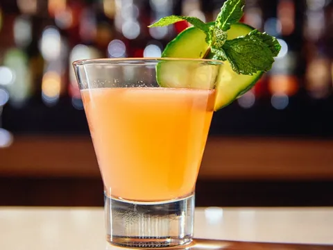 A craft cocktail garnished with cucumber and mint at Bittercreek Alehouse