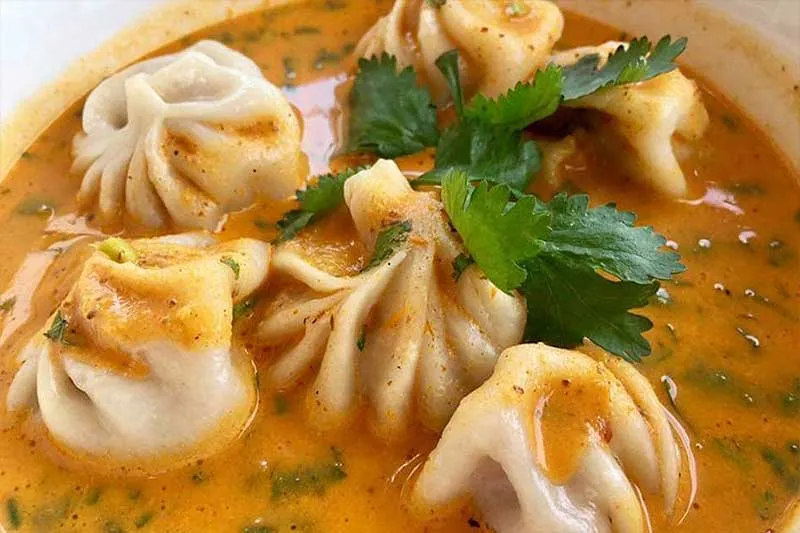 Jhol momo served in spiced broth at Taste of the Himalayas