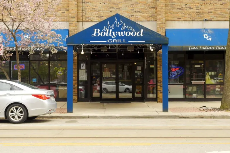 Blue-awninged storefront of Bollywood Grill on North Jackson Street in Milwaukee