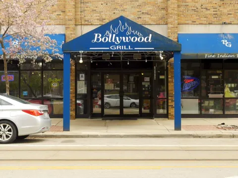 Blue-awninged storefront of Bollywood Grill on North Jackson Street in Milwaukee