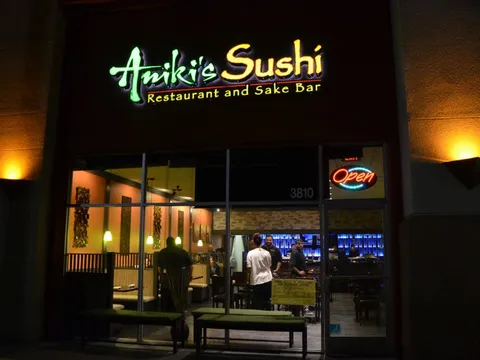 Illuminated storefront sign at Aniki's Sushi in Fremont