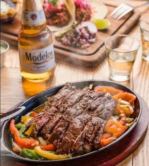 Steak fajitas with peppers and onions served at Los Agaves Santa Barbara