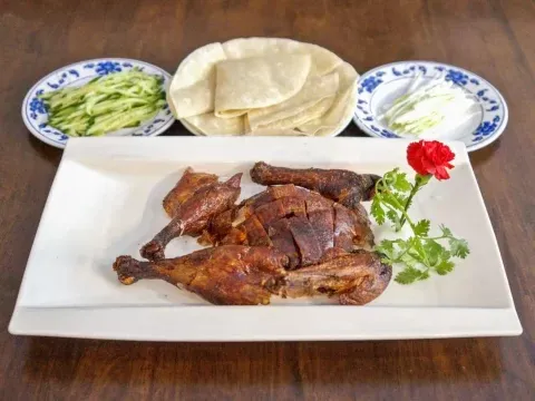 Roast duck served with pancakes and cucumber at Grand Sichuan Eastern