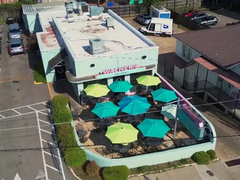 Aerial view of Walker's Drive In and its umbrella-shaded patio in Fondren