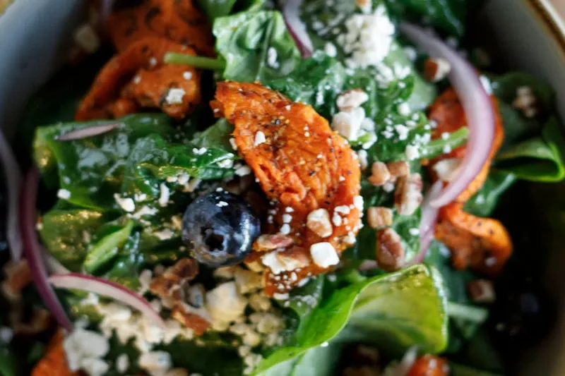 Spinach salad with blueberries, feta, and pecans at Red Bird Sandwich Company