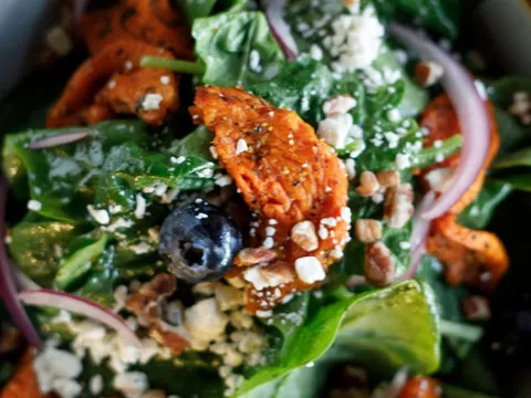 Spinach salad with blueberries, feta, and pecans at Red Bird Sandwich Company
