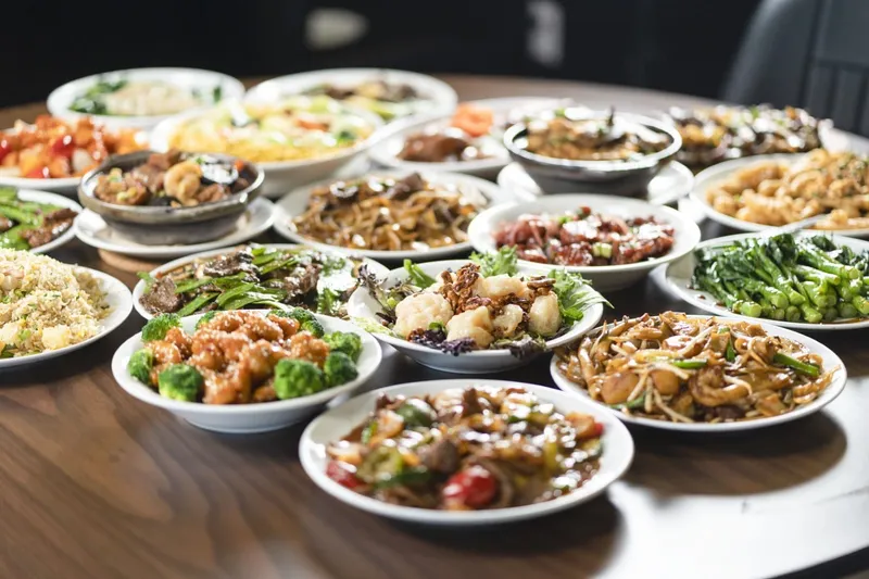 Table spread of Cantonese dishes at Yummy House China Bistro in Tampa