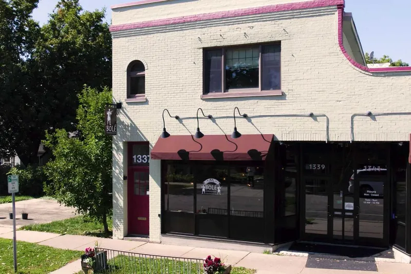 Cream-brick storefront of Bolé Ethiopian Cuisine at 1341 Pascal St N, St. Paul, with maroon awnings and posted hours on the door