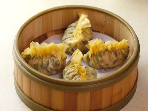 Bamboo steamer of steamed mushroom and vegetable dumplings at Hong Kong Lounge