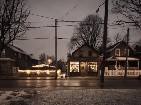 Lucky's Cafe storefront lit up at dusk in Tremont