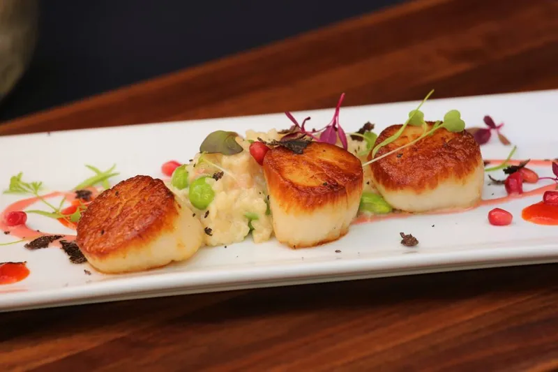 Seared scallops with risotto and microgreens at Zambra