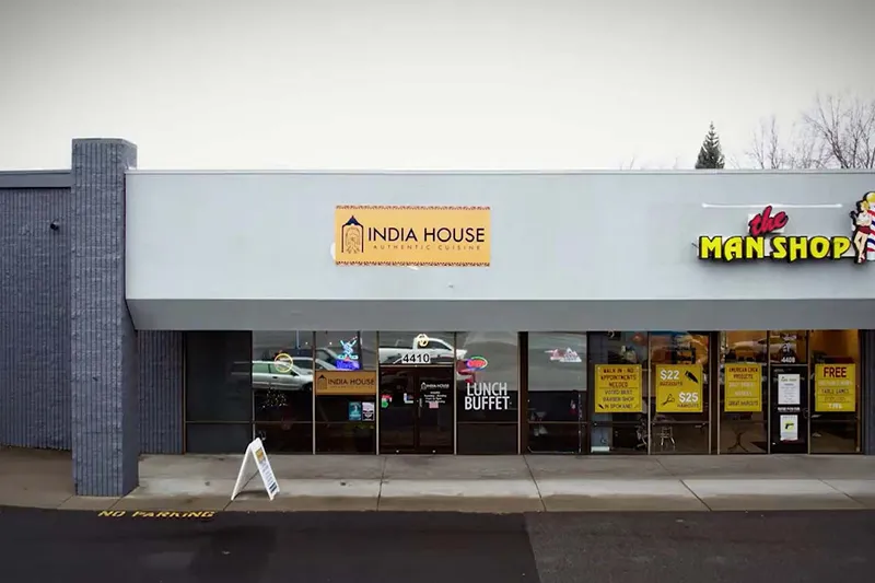 India House storefront in a South Regal Street strip mall in Spokane, with a lunch buffet sign in the window