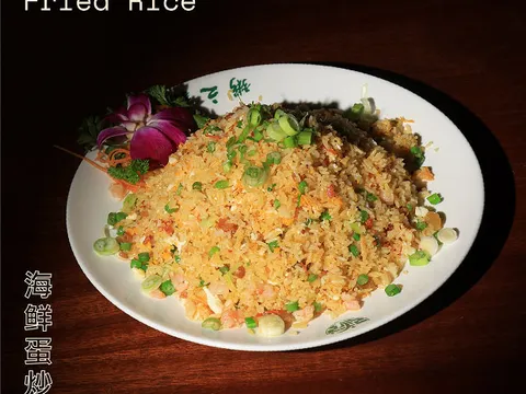 Golden egg seafood fried rice plated at Congee Village