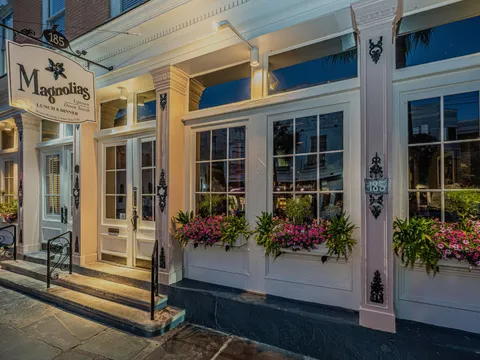 Magnolias restaurant's East Bay Street storefront at dusk