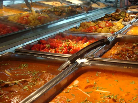 Buffet trays of curries and tandoori dishes on the hot line at Madhuban Indian Cuisine in Boise