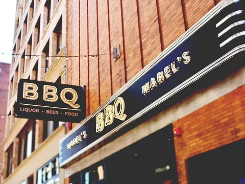 Mabel's BBQ neon sign above the entrance in downtown Cleveland