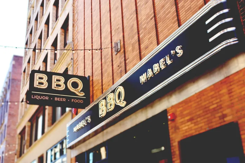 Mabel's BBQ neon sign above the entrance in downtown Cleveland