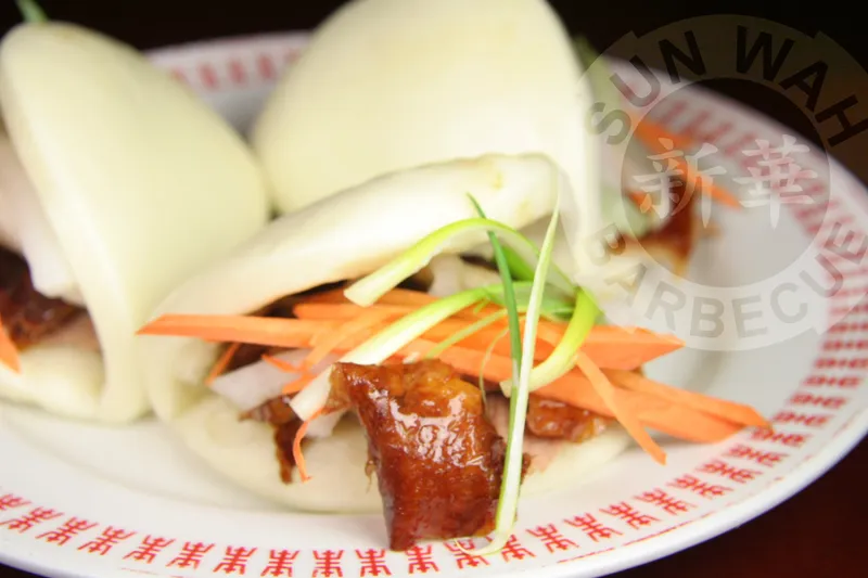 Roast meat served with steamed buns at Sun Wah BBQ