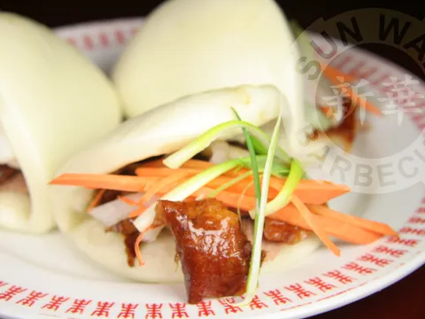 Roast meat served with steamed buns at Sun Wah BBQ