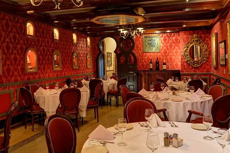 The ornate red-walled Red Room dining room at Columbia Restaurant, set for service
