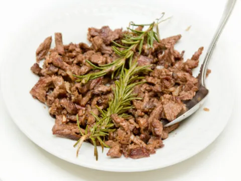 Plate of Meaza beef tibs, sautéed beef cubes garnished with rosemary, at Meaza Restaurant, Falls Church VA