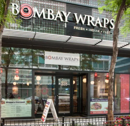 Bombay Wraps Streeterville storefront with the restaurant sign above its glass entrance