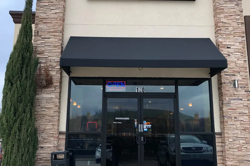 Storefront of Pista House in Irving with the green 'Pista House — Biryani, Haleem & Kabobs' sign above the entrance