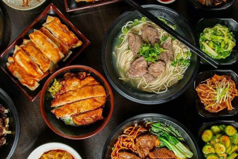 Assortment of noodle, rice, meat and vegetable dishes at A & J Restaurant
