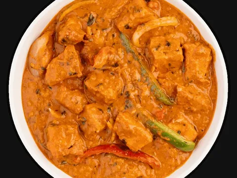 Chicken tikka masala with green chile in a white bowl, from Tikka Drive in Chandler