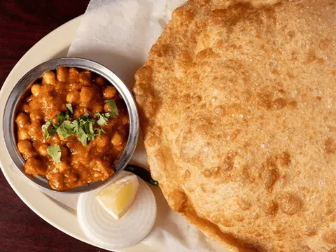 Chana batura — chickpea curry with a large puffed fried batura bread at Udupi Cafe