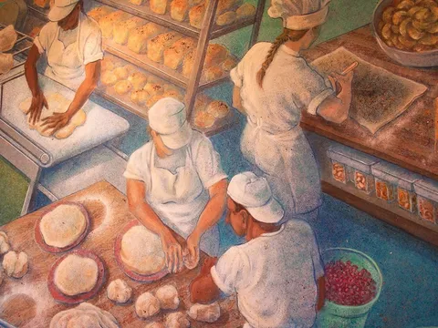 Baker kneading dough at Flying Star Cafe