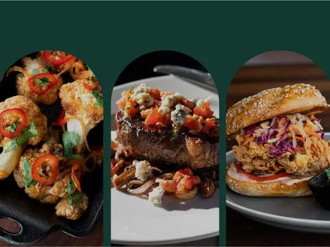 A selection of dishes at The Belmont, including a sandwich, cauliflower, steak, fried chicken sandwich, and salmon