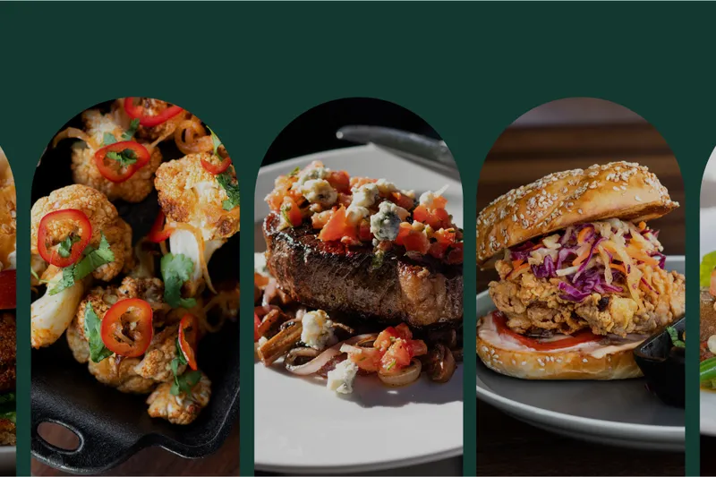 A selection of dishes at The Belmont, including a sandwich, cauliflower, steak, fried chicken sandwich, and salmon