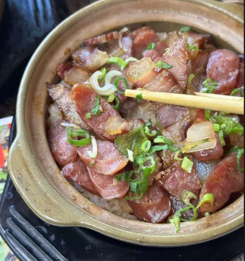 Clay pot rice topped with Chinese sausage, preserved meats and scallions at Clay Pot Cafe