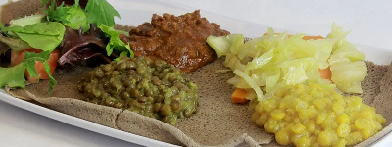 Ethiopian vegetarian combination of lentils, split peas, cabbage and salad served over injera at Chercher Ethiopian Restaurant