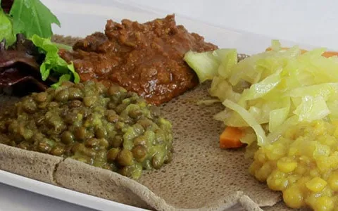 Ethiopian vegetarian combination of lentils, split peas, cabbage and salad served over injera at Chercher Ethiopian Restaurant